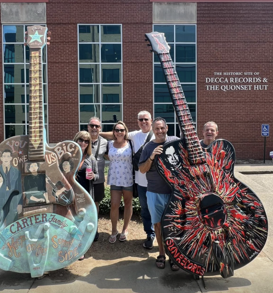 Group photo with the painted guitar statues at the historic site of Decca Records and the Quonset Hut on Music Row